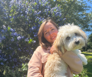 Woman holding puppy in arms