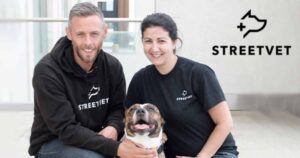 StreetVet co-founders Jade Statt and Sam Joseph kneeling with a dog