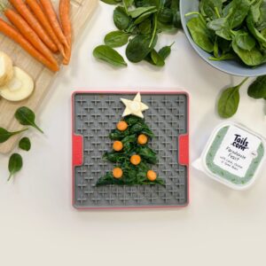 Christmas LickiMat recipe - spinach and wet food arranged in the shape of a Christmas tree on a LickiMat